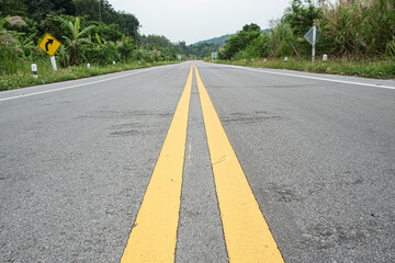 Obraz premium The yellow line divides the route.selective focus