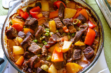 Beef Kaldereta is a Filipino stew or casserole made with beef, potatoes, carrots, peas and olives...