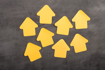 Blank yellow house shaped sticky note - real estate concept