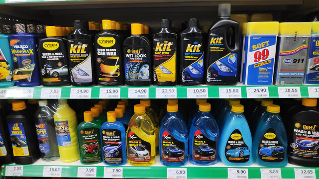 Various car wash detergent in bottles on shelves in supermarket