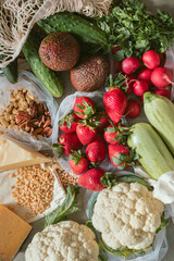Fresh ingredients from market. Directly above shot of vegetables in reusable shopping bags.