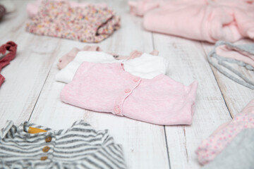 White and pink premium baby clothes folded