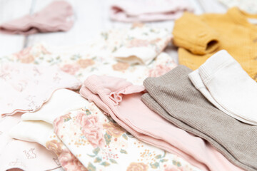 Pink, white and brown baby clothes for girls with flowers