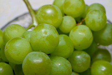 green grapes in a crystal vase