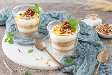 Natas do Ceu is a traditional Portuguese dessert made with cream, eggs and biscuits decorated with pecan nuts and mint leaves