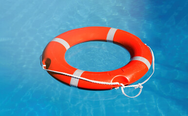 Lifebuoy on blue water surface
