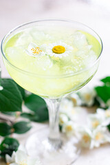 Refreshing chamomile drink. Very narrow focus, the center of the drink in focus.