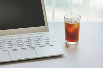 Notebook computer and an iced coffee