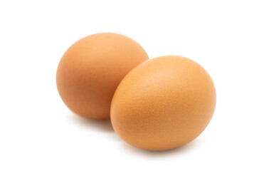 Two chicken eggs isolated on white a background.