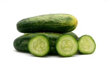 cucumber slices over on background.