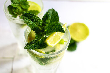 Mojito summer refreshing cocktail with ice, lime and mint