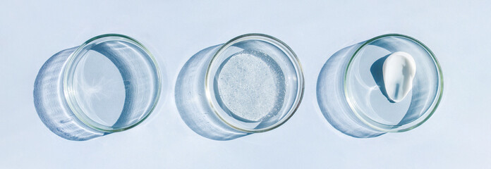 Petri dish with a sample of a cream smear with a transparent gel serum on a light background