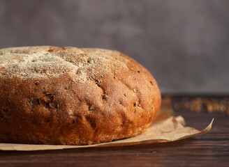 round buckwheat bread on a wooden background