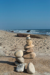 Fototapeta na wymiar Rock cairn at Moshup Beach Marthas Vineyard