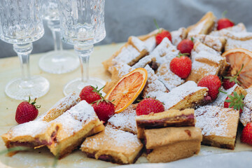 picnic in the park with delicious pastries and strawberries. mood. close up of food