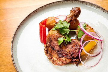 chicken with baked potato and vegetables