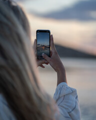 two girls in bikini spending a day on the beach at sunset
