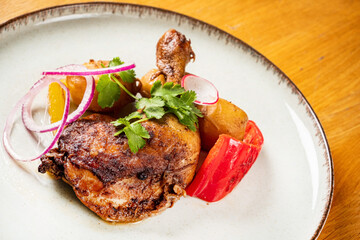 chicken with baked potato and vegetables