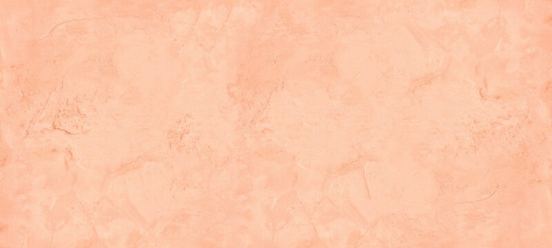 Pastel peach color painted old rough cement plaster widescreen texture. Aged exterior wall light orange wide background