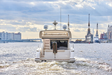 Luxury private motor yacht sailing in the river