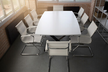 Naklejka na ściany i meble stylish table with chairs for business meetings in the office