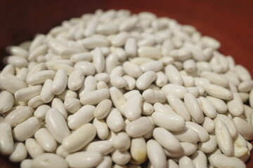 white beans on a red background