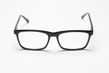 Carbon fiber degree glasses in black color. Front view and white background. Space for text.