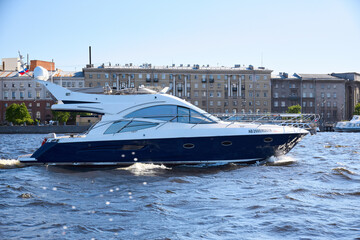 Obraz premium Photo of a yacht sailing on the river