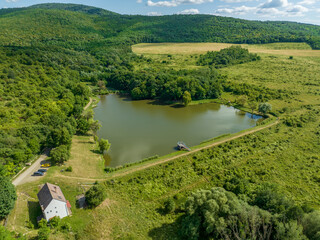 Fototapeta na wymiar Hungary - Nagyborzsony (Nagybörzsöny) - Borzsony hills (Börzsöny hills) and around the forest from drone view. one of the closest mountains to Budapest, which provides a great hiking opportunity
