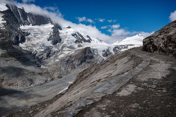 Fototapeta premium Mountain landscape with snow-capped peaks and blue sky