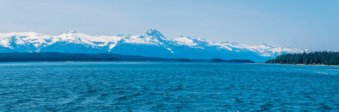 A panorama view from Auke Bay towards the Gastineau channel on the outskirts of Juneau, Alaska in summertime