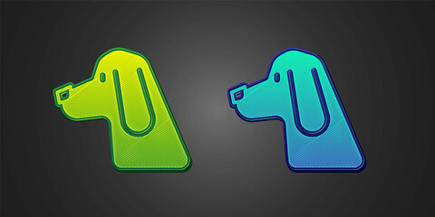 Green and blue Hunting dog icon isolated on black background. Vector