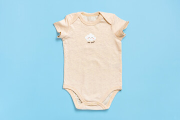 beautiful accessories - clothes for newborn, cotton isolated on blue background Copy space Concept of childhood, motherhood, fashion textile and newborn Top view Flat lay