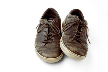 Beautifully aged vintage brown leather boots isolated on white background