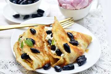 Homemade pancakes with cottage cheese and honeysuckle berries