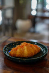 salted egg croissant on the plate