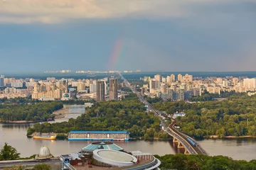 Foto op Canvas Skyline of Kyiv with Metro bridge and rainbow in the sky. © Ryzhkov Oleksandr