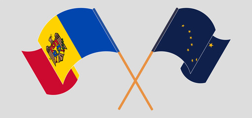 Crossed and waving flags of Moldova and the State of Alaska
