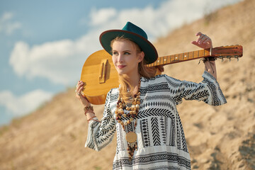 hippie girl with guitar