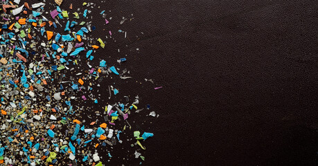 Close-up on micro plastic particles. The concept for water pollution and global warming. Macro shot...