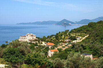 Obraz premium Summer landscape of Montenegro coastline. Adriatic Sea. Budva resort in background.