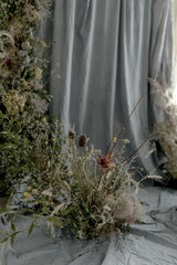 Wedding arch with dried flowers, natural flowers, gray background