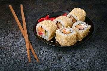 Shrimp and sesame rolls on a plate, oriental cuisine concept, shallow depth of field