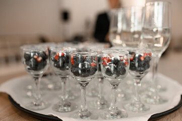 Frozen berries in a glass. Dessert for a party in a restaurant.