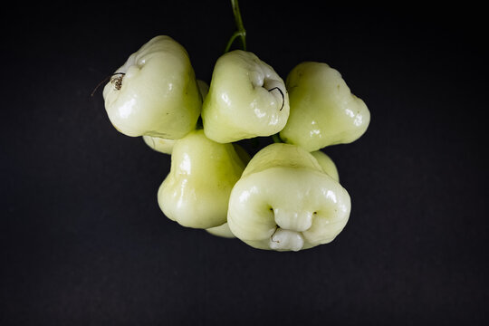 Fresh organic wax apple or jaamrul isolated on black background