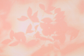 Fototapeta na wymiar Shadow and light of leaves tree branch background. Natural colorful leaf pastel pink beige, rose gold shadow and light from sunlight on white wall texture for wallpaper overlay effect and design