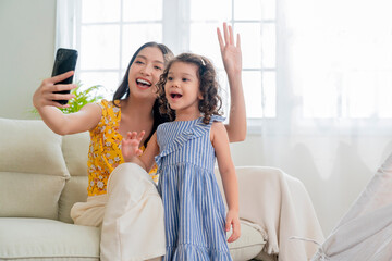 happiness lifestyle at home ,asian female woman nanny aupair takecare playing smartphone selfie...