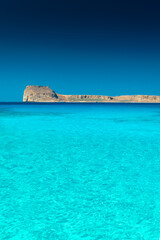 Amazing crystal clear water and view of Gramvousa Island in the Balos Lagoon, Crete,  Greece