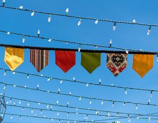 Cloth flags overhang with lights
