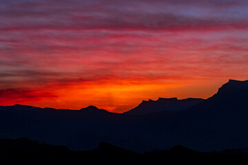 sunset in the mountains, evening landscape with bright sky